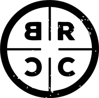 Circular logo divided into four quadrants with letters BR in top half and SC in bottom half, separated by cross lines